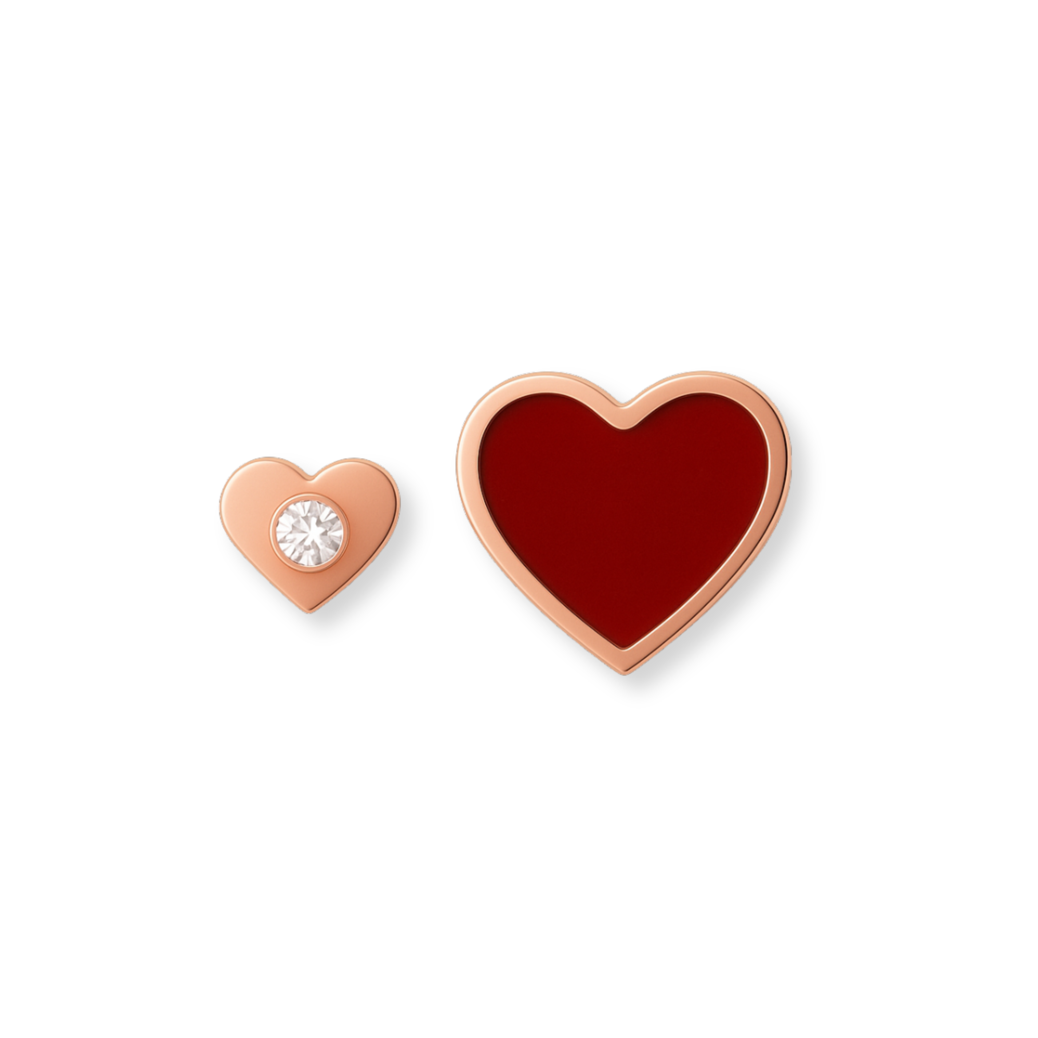 Heart-shaped earrings with one having a clear gemstone on a white background