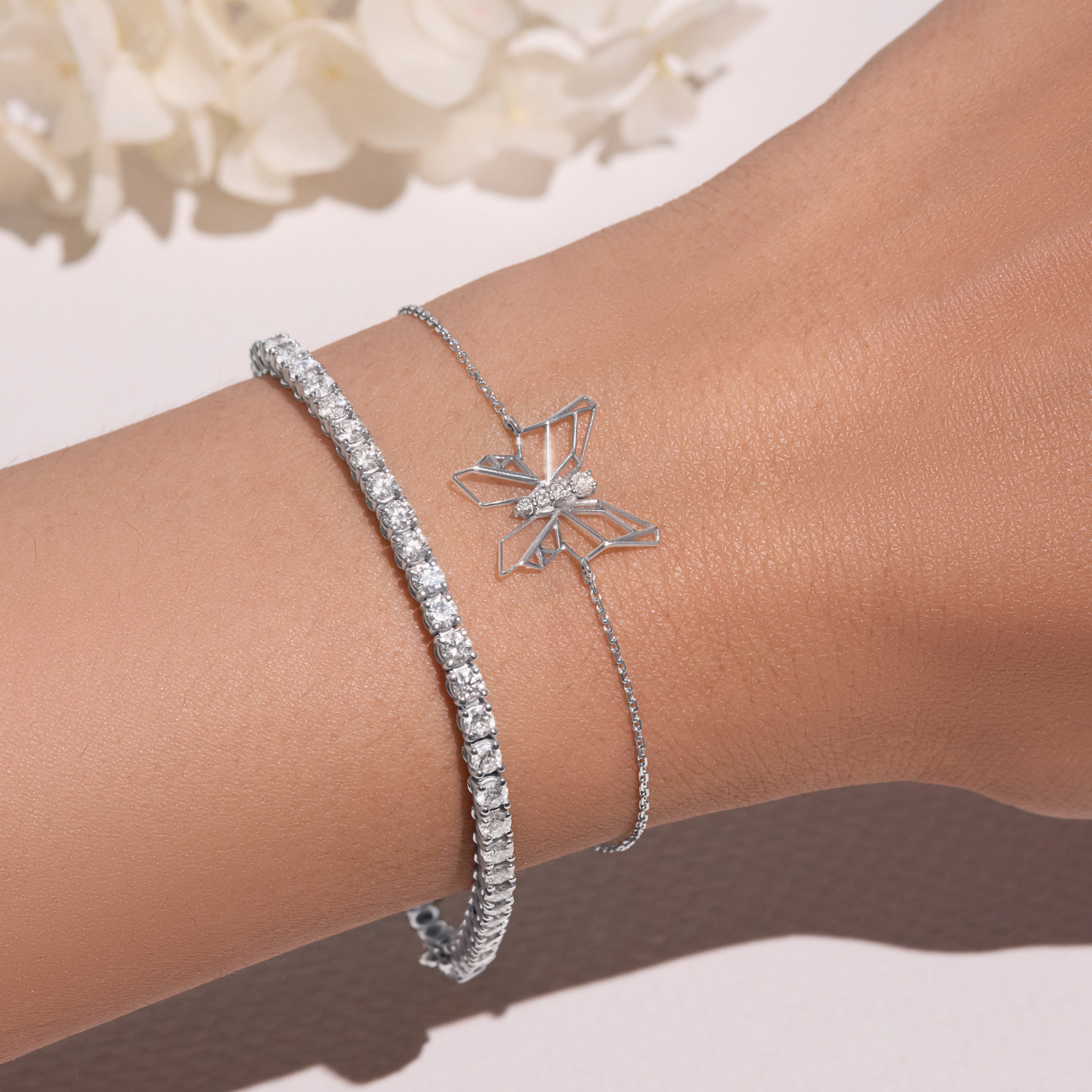 White gold butterfly bracelet on a white background